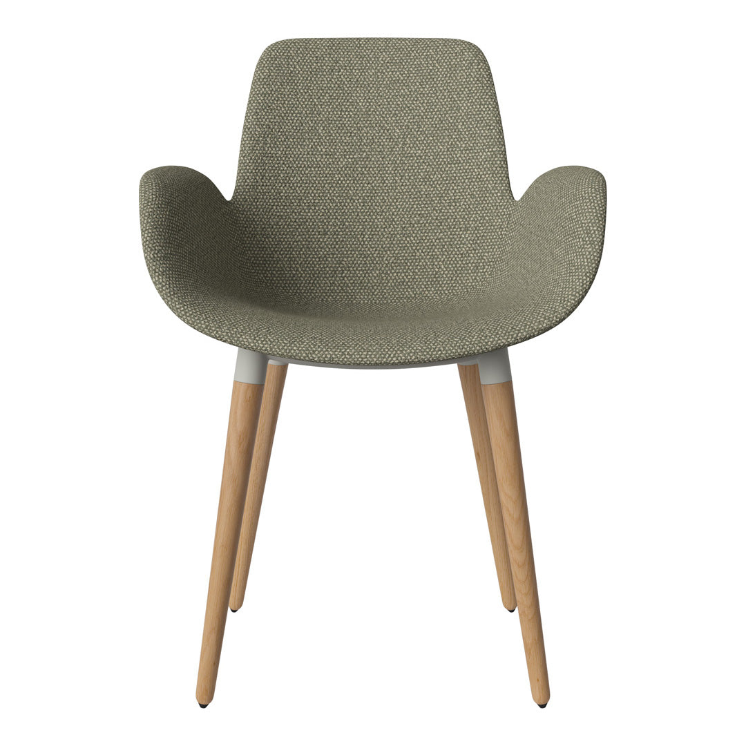 Green patterned fabric chair with light wood legs and a modern design. Perfect for stylish home decor.