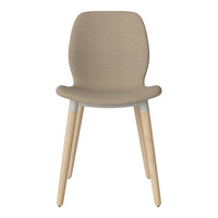 Beige upholstered chair with light wooden legs and a smooth, minimalist design. Ideal for modern decor.