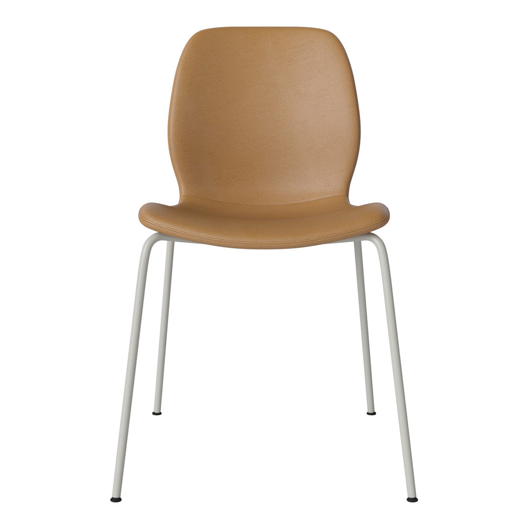 Tan molded seat with a smooth texture and sleek white metal legs, perfect for modern decor.