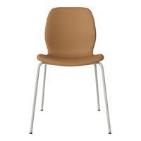 Tan chair with a smooth texture and sleek white metal legs, perfect for modern decor.