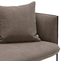 Brown fabric sofa with a coordinating cushion, featuring a smooth texture and minimalist design.