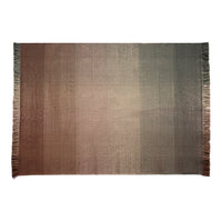 Gradient rug showcasing warm earthy tones transitioning from deep brown to soft beige with fringed edges.