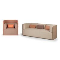 Beige sofa and armchair with soft peach and terracotta accent cushions, featuring a modern minimalist design.