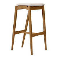 Wooden bar stool with natural oak finish and soft white cushion seat, featuring a sleek, minimalist design.