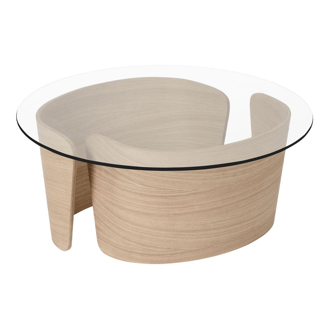 Modern coffee table featuring a natural wood finish and a clear glass top, showcasing minimalist curves and soft lines.