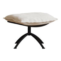 Cream upholstered cushion on a sleek black metal base, featuring a minimalist design with soft textures.