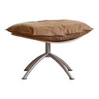 Brown cushioned ottoman with a sleek metallic base, featuring a contemporary design and minimalist style.