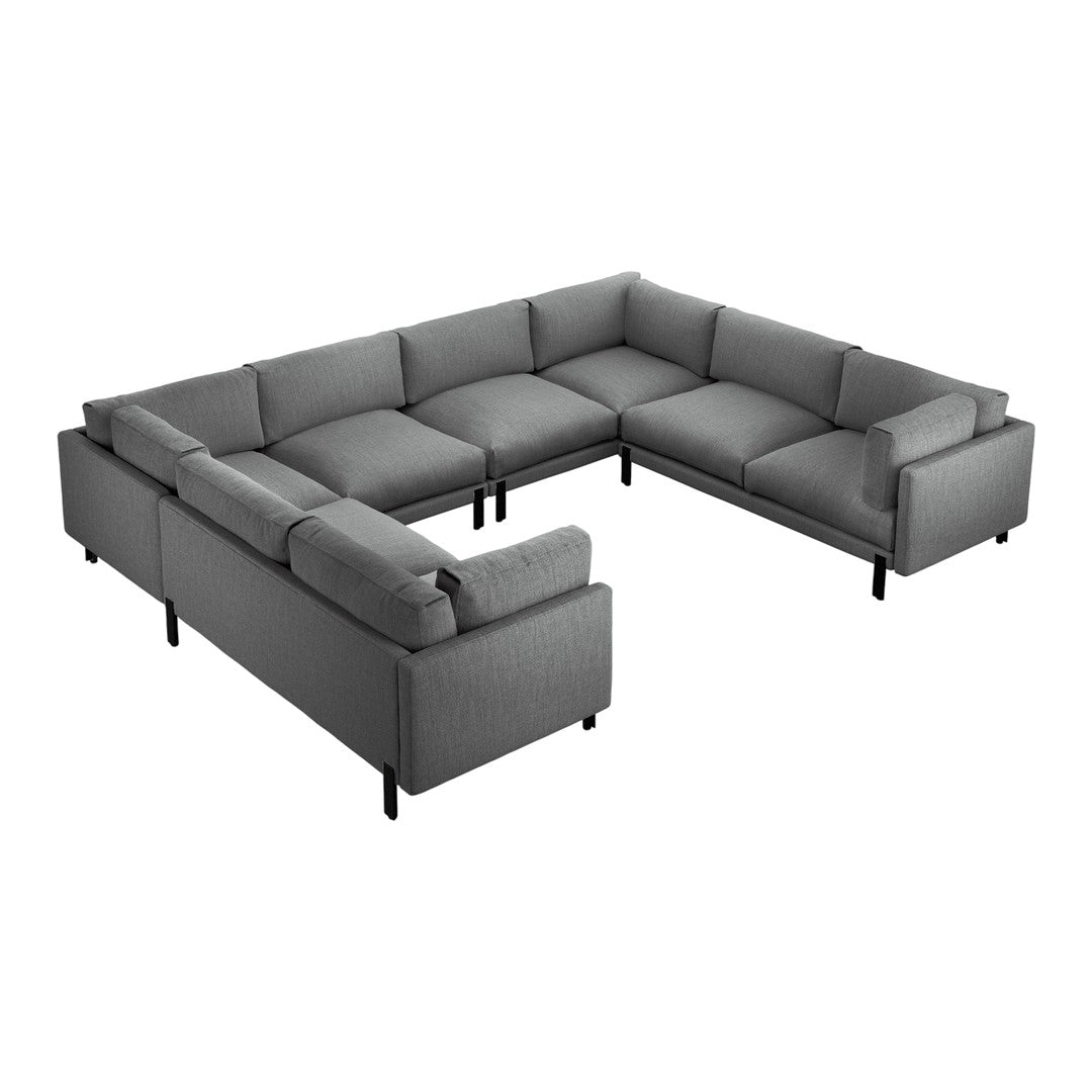 Gray sectional sofa with a modern design, featuring textured fabric and sleek black legs for a contemporary look.