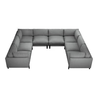Gray sectional couch with a sleek, modern design and a soft, textured fabric finish. Ideal for any living space.