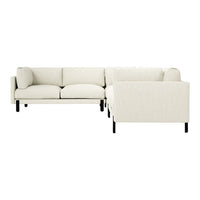 L-shaped sofa in creamy white fabric with minimalist black legs, perfect for modern decor.