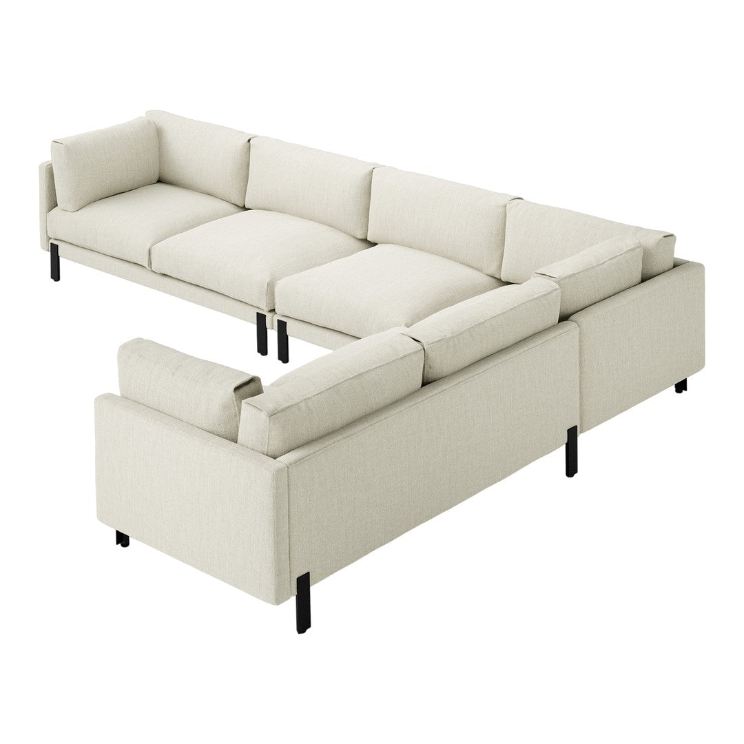 Light beige sectional sofa with soft texture and clean lines, featuring black metal legs for contrast.