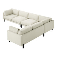 Light beige sectional sofa with soft texture and clean lines, featuring black metal legs for contrast.