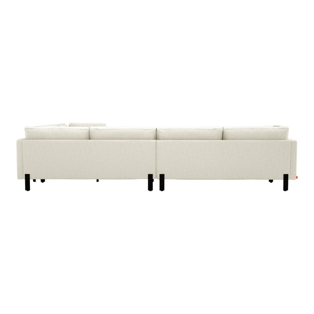 Light beige sectional sofa with subtle texture, featuring sleek black legs for a modern contrast.