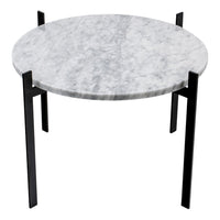 Round marble table with a sleek gray surface and contrasting black metal legs, perfect for modern decor.