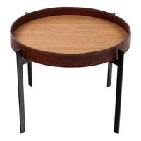 Round coffee table with a brown leather trim, a sleek wooden top, and black metal legs. Perfect for modern decor.
