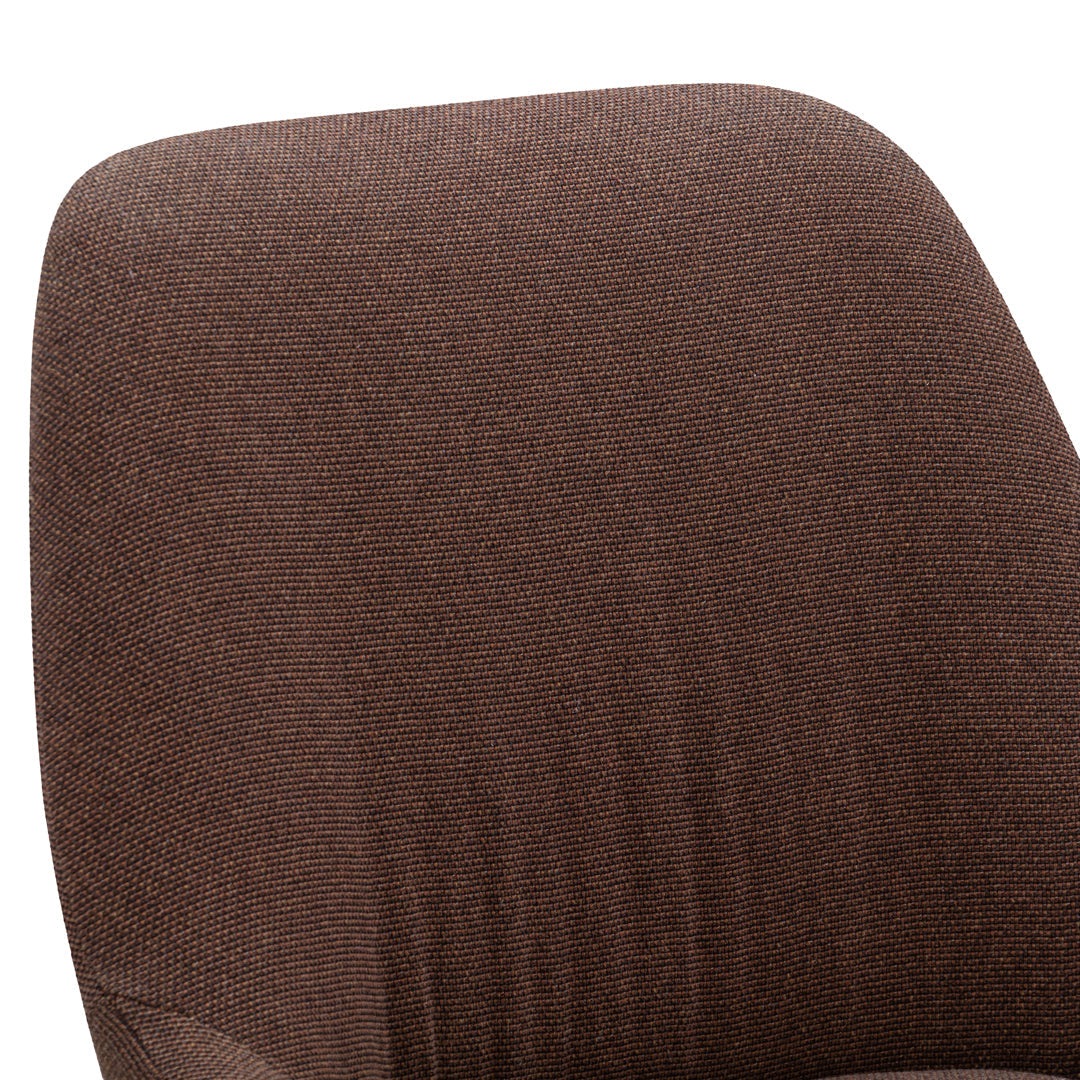 Brown textured chair upholstery with a subtle, woven pattern. Perfect for a stylish and cozy interior.