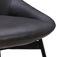 Smooth black leather chair with a minimalist design and sleek curves, complemented by a sturdy black metal frame.