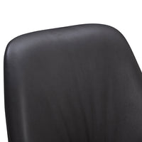 Black ergonomic chair with smooth, matte finish and subtle texture on the backrest for modern aesthetics.