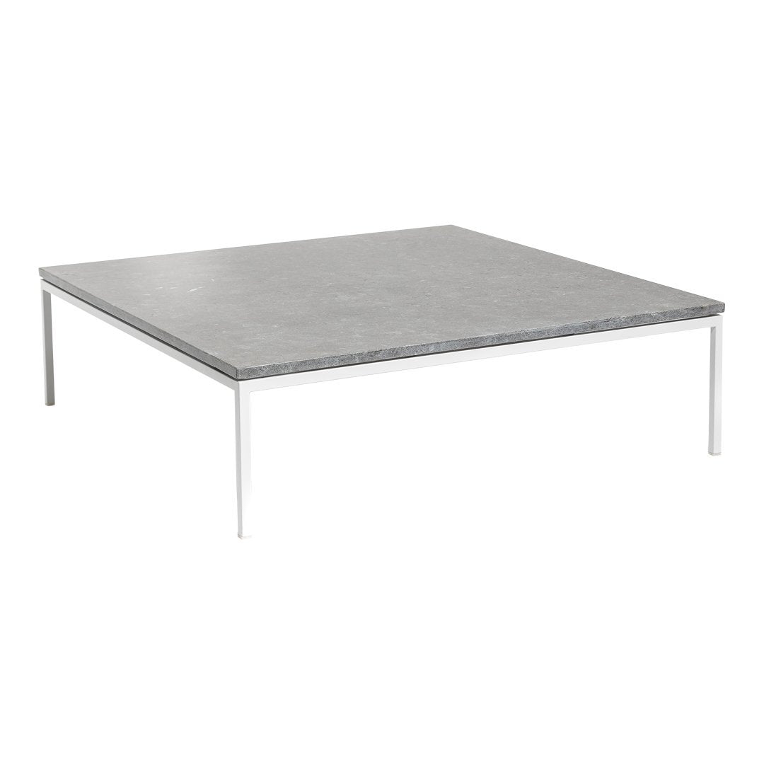 Gray square tabletop with a smooth finish, complemented by sleek silver legs. Modern minimalist design.
