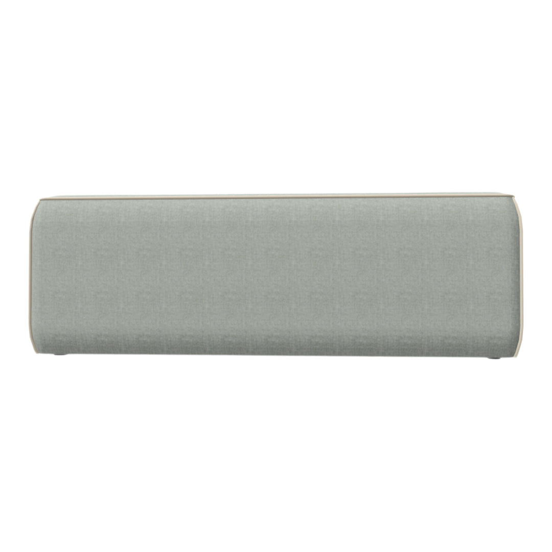 Soft teal fabric bench with a textured finish and subtle beige trim detailing. Ideal for modern decor.