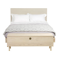 Light beige bed frame with white bedding and a gray geometric patterned throw. Minimalist design with natural wood accents.