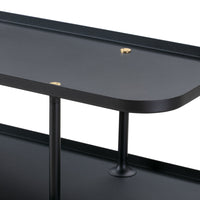 "Elegant black metal table with sleek, rounded edges and brass accents."