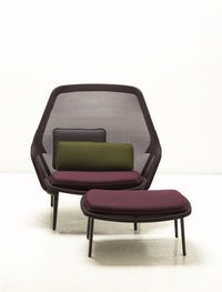 Modern chair with deep purple and green cushions, featuring a sleek black mesh frame and minimalist design.