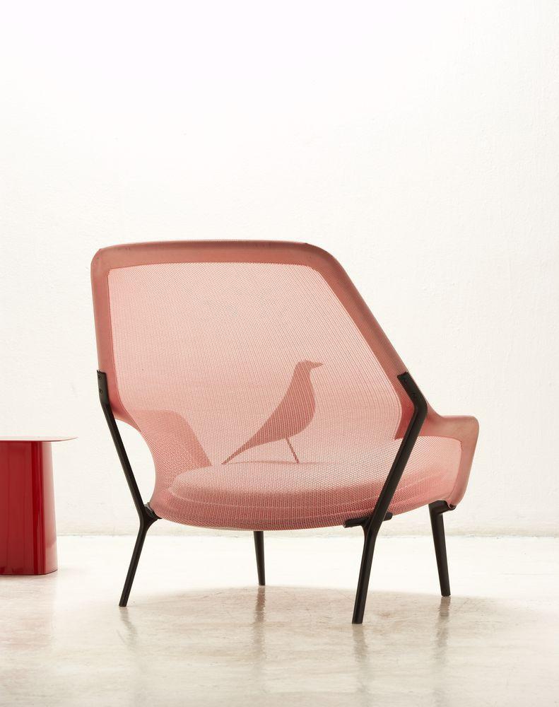 Pink mesh chair with a bird pattern and sleek black legs, perfect for modern decor.