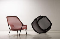 Modern two-tone chair featuring soft pink mesh and sleek black frame, showcasing a contemporary design.