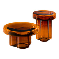 Amber glass coffee tables with smooth, glossy surfaces and modern silhouette. Ideal for contemporary decor.