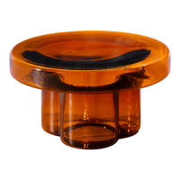 Amber glass bowl with a smooth, round shape and subtle black accents, featuring a modern design. Ideal for decor or storage.
