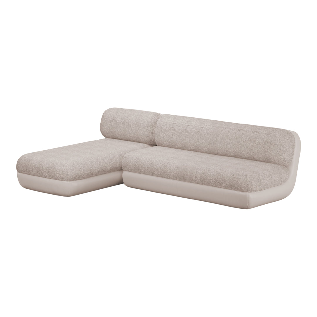 "Light beige sectional sofa with textured upholstery and smooth cream accents, perfect for stylish home decor."