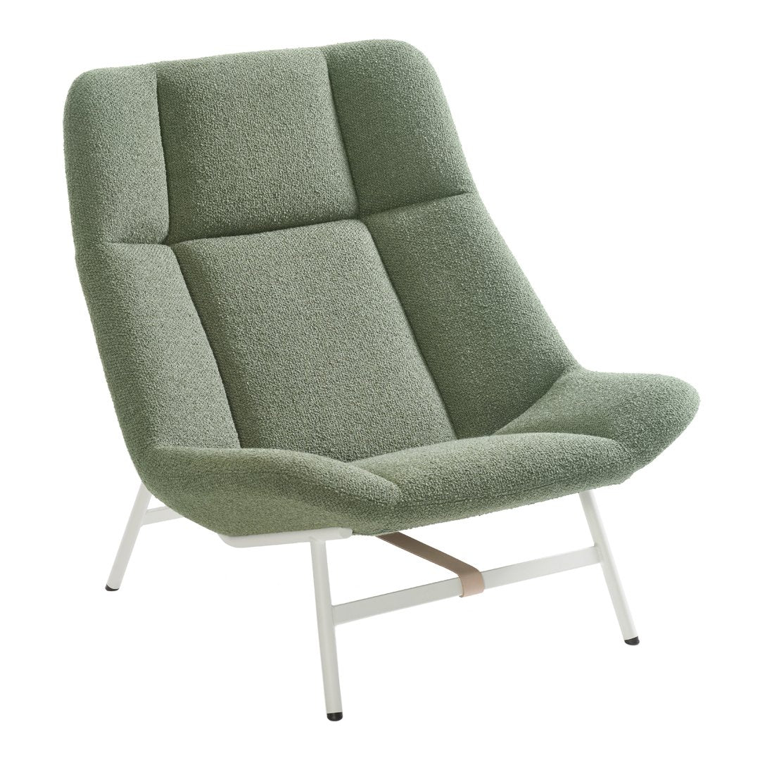 Soft green upholstered chair with a modern, minimalistic design and subtle geometric patterns. Perfect for contemporary decor.