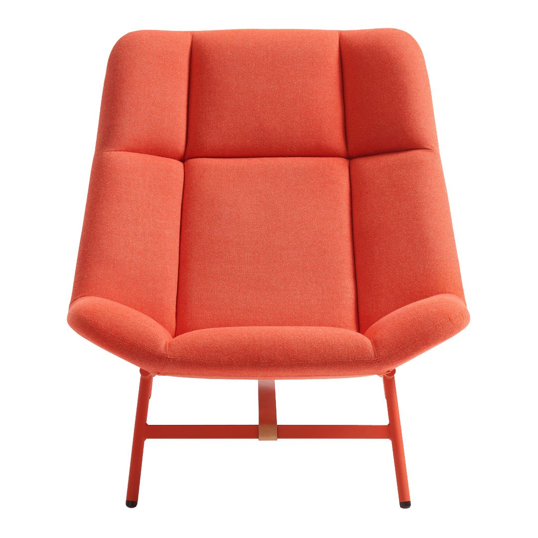 Modern coral lounge chair with a textured, plush fabric and a sleek, minimalist design. Perfect for any contemporary space.