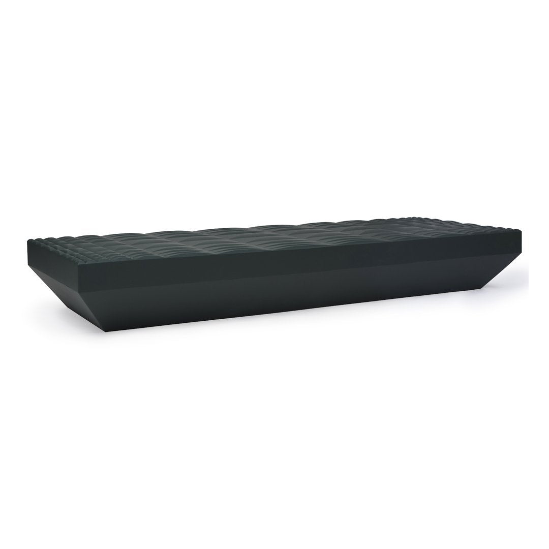 Black rectangular coffee table with a unique ribbed pattern and smooth edges, ideal for modern decor.