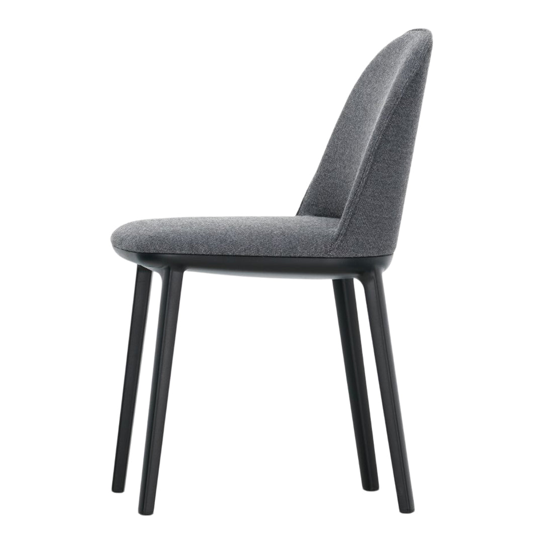 Modern gray upholstered chair with a smooth texture and sleek black legs, featuring a minimalist design.