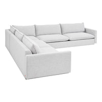 Light gray sectional sofa with a smooth upholstery texture and plush cushions, perfect for modern decor.