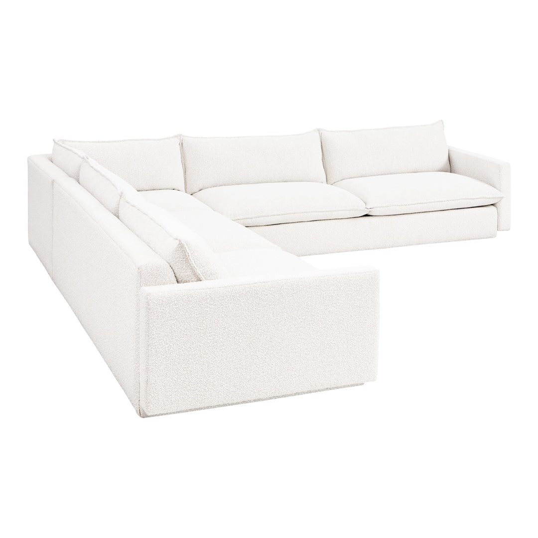 "Cozy, textured white sectional sofa with soft cushions, perfect for modern living spaces."