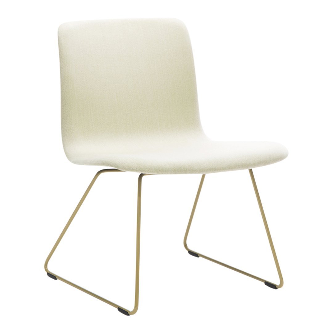 Beige modern chair with minimalist design and gold metal legs, perfect for any contemporary space.