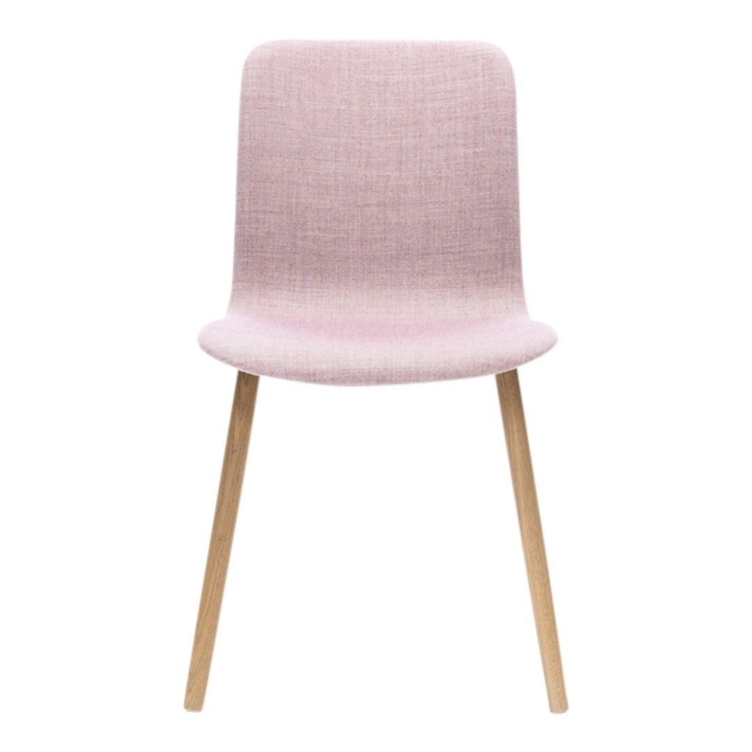 Light pink upholstered chair with a smooth texture and natural wooden legs.