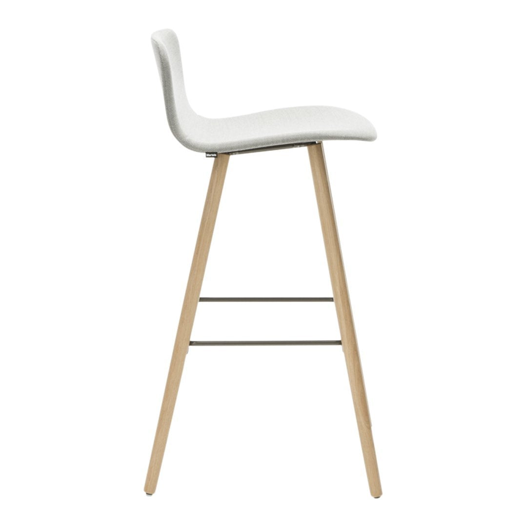 White upholstered bar stool with natural wood legs and a minimalist design, perfect for modern interiors.