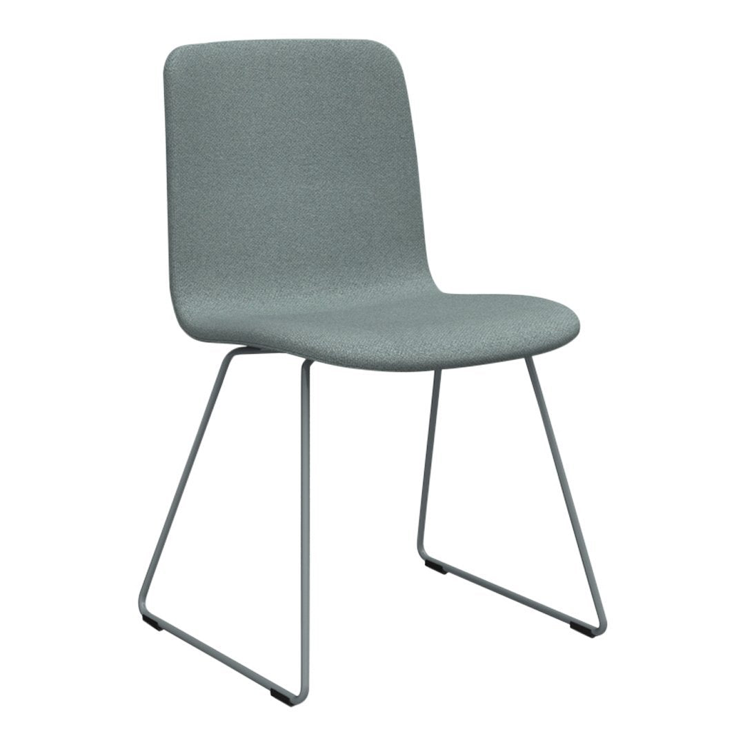 Gray upholstered chair with a sleek, minimalist design and wireframe legs, perfect for modern decor.