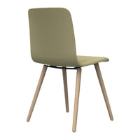 Green upholstered chair with a smooth finish and light wooden legs, featuring a minimalistic design.