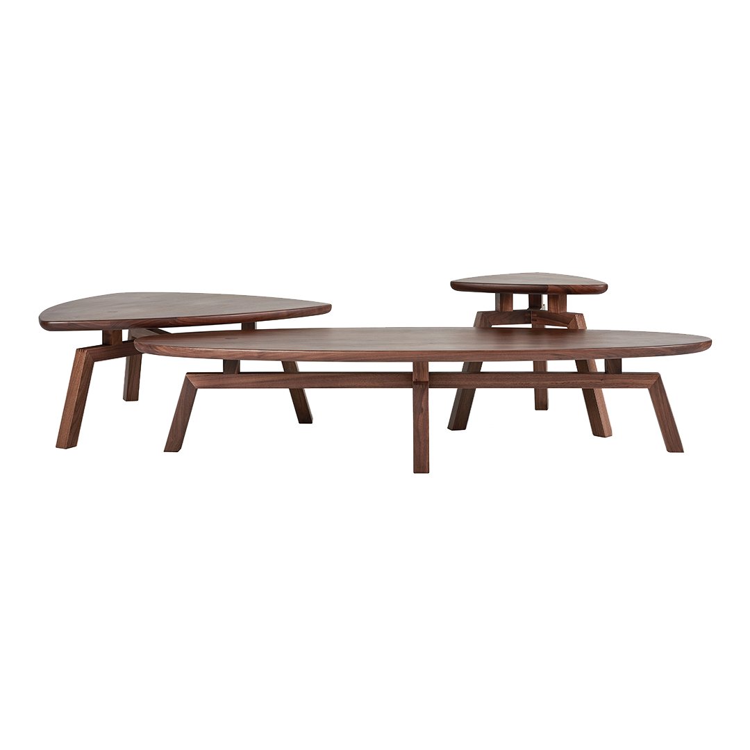 Three modern wooden coffee tables in rich brown tones with smooth, organic shapes and clean lines.