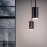 "Black and white marble pendant lights with sleek cylindrical design, featuring glossy finishes and subtle patterns."
