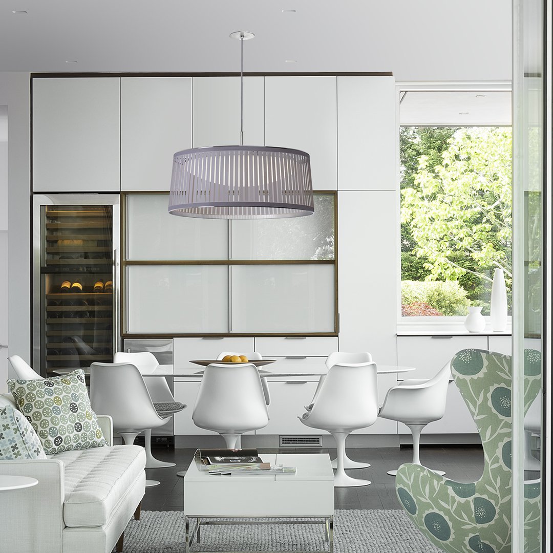 Modern dining room featuring a gray striped pendant lamp, white furniture, and green patterned accents.