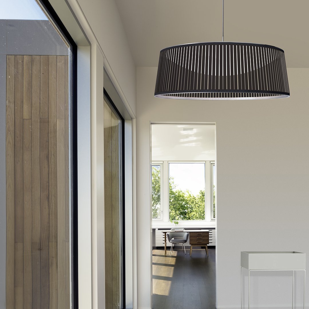 Black pleated pendant lamp with a sleek, modern design, adding texture and elegance to contemporary interiors.