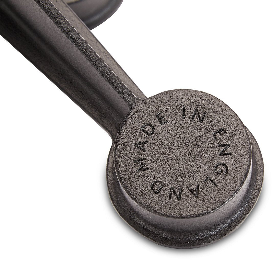 Dark gray, textured surface with circular pattern and embossed "Made in England" label.