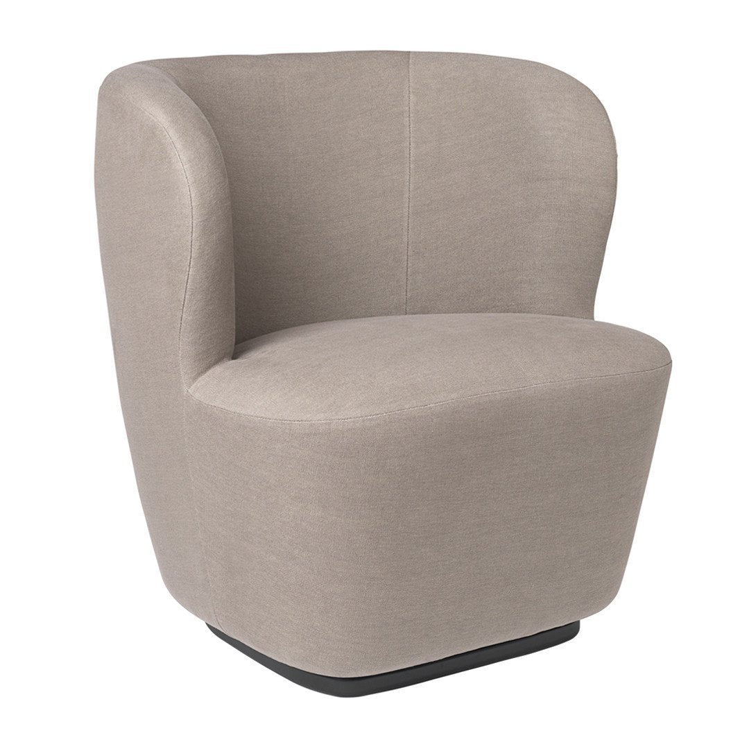 Beige upholstered accent chair with a smooth, rounded design and minimalist pattern on a black base.
