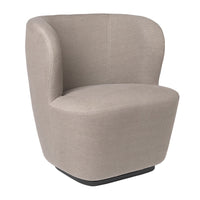 Beige upholstered accent chair with a smooth, rounded design and minimalist pattern on a black base.
